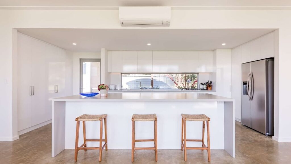 sleek kitchen overlooks bushland