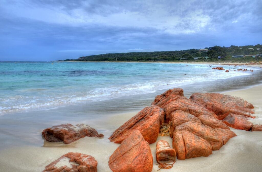Cluster of large red rocks on Eagle Bay