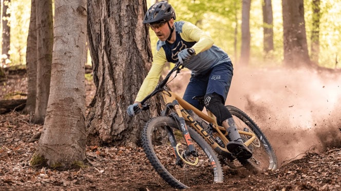 Active mountain biker navigating the lush green Meelup trails in Dunsborough, WA