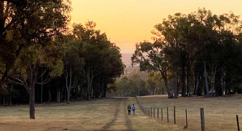 A couple taking a stroll with a picturesque view in Bridgetown, WA