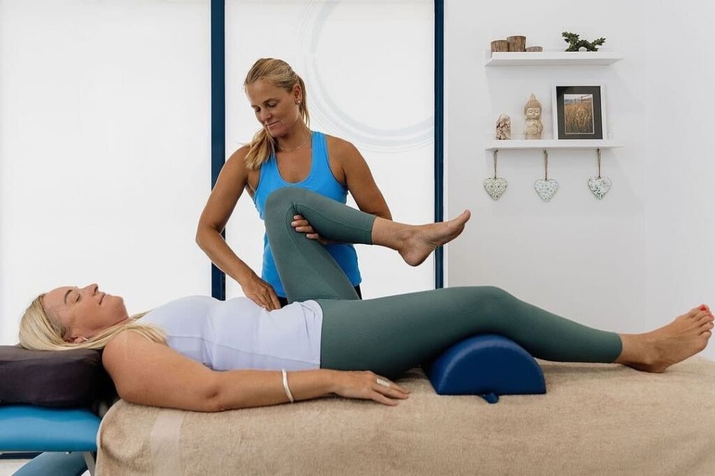 Woman performing Bowen therapy treatment
