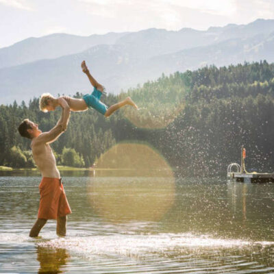 dad with son in Lakes during summer